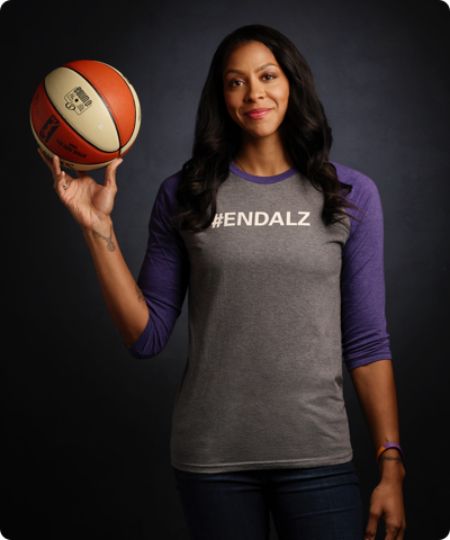 Candace Parker poses for a picture in a grey t-shirt.